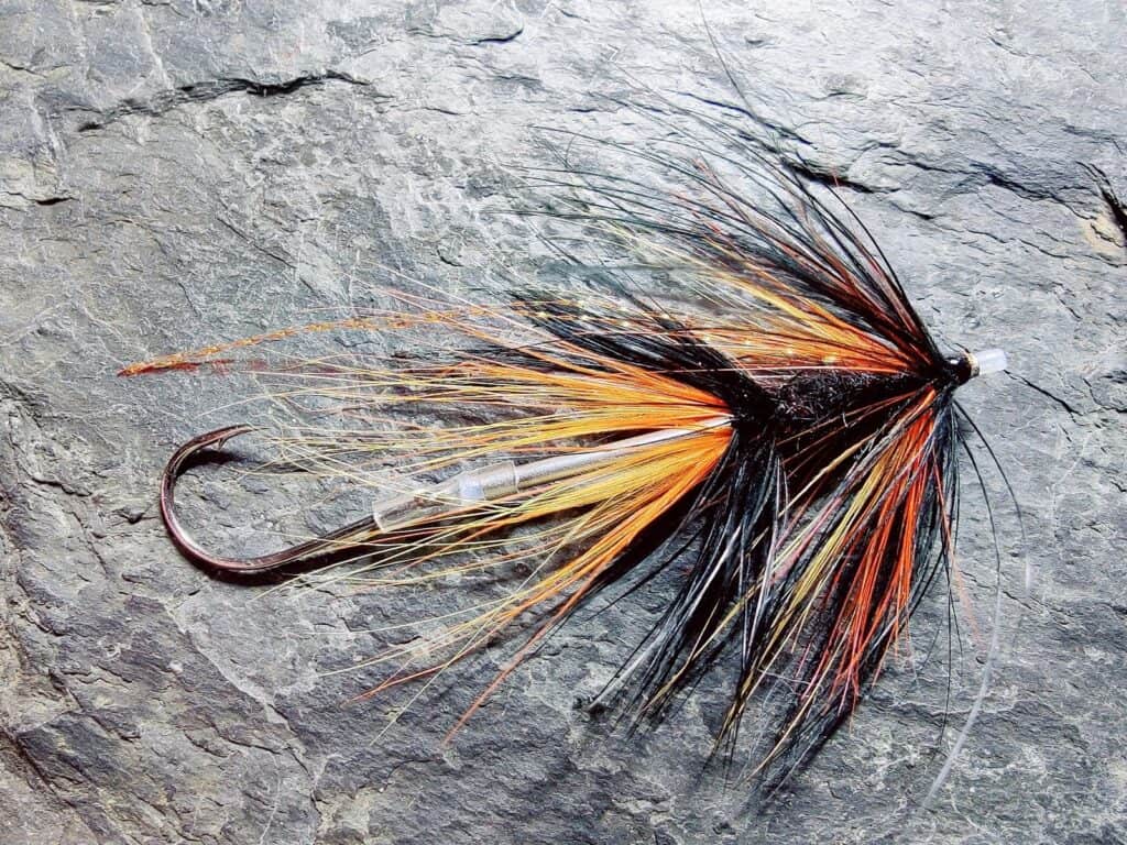 Black and Orange Intruder Tube Fly